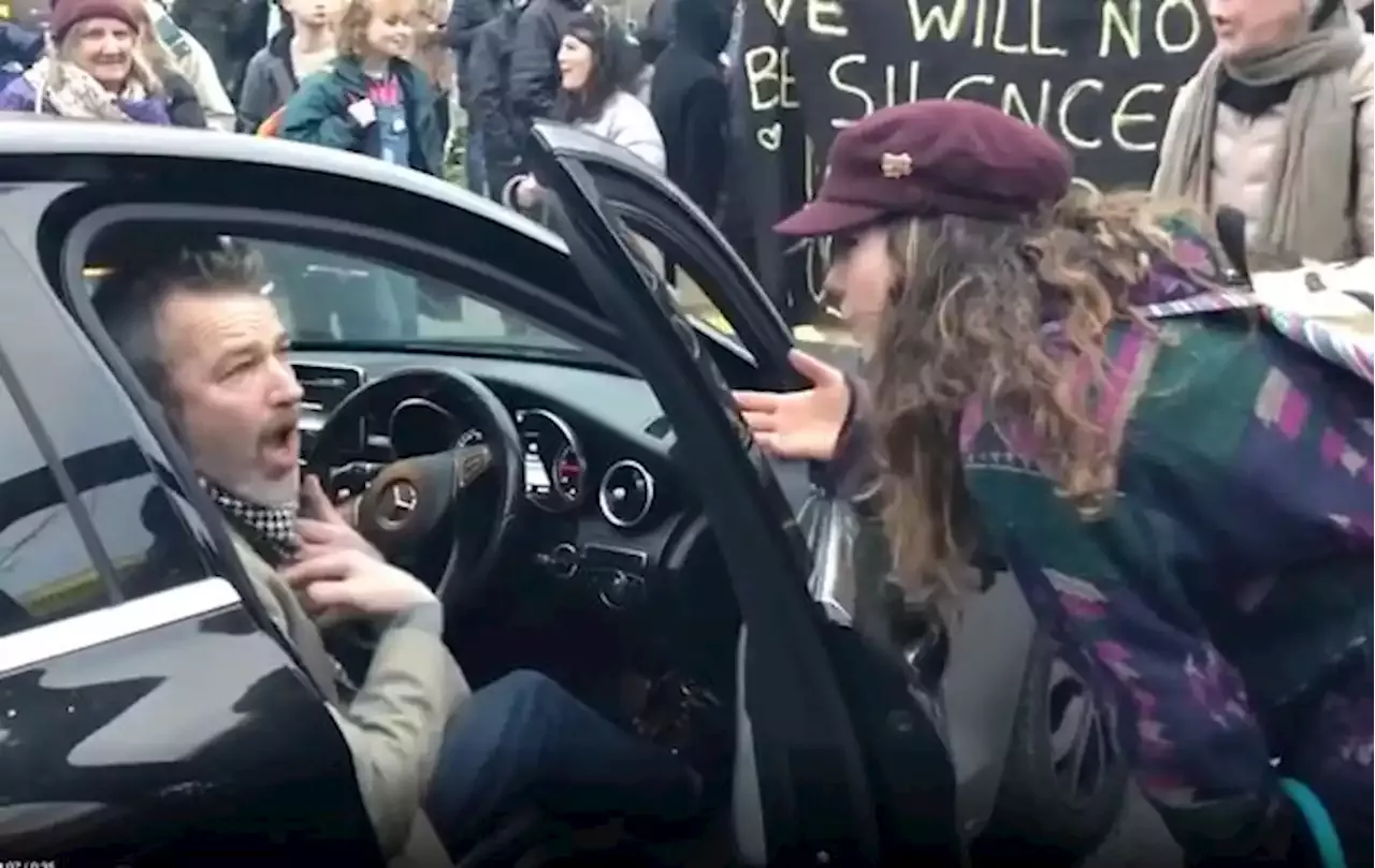 Driver rows with Kill The Bill protestors blocking car as he 'wants to go home'