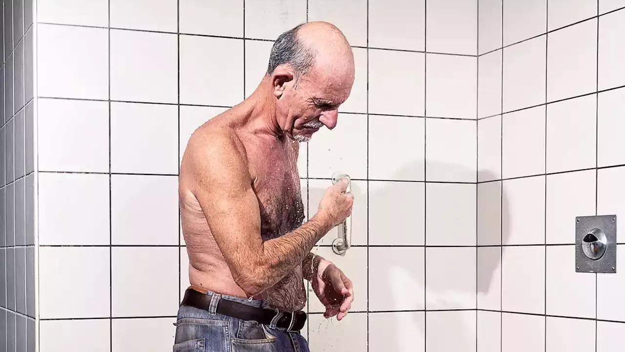Eastern European Man In Gym Locker Room Showering With Jeans On